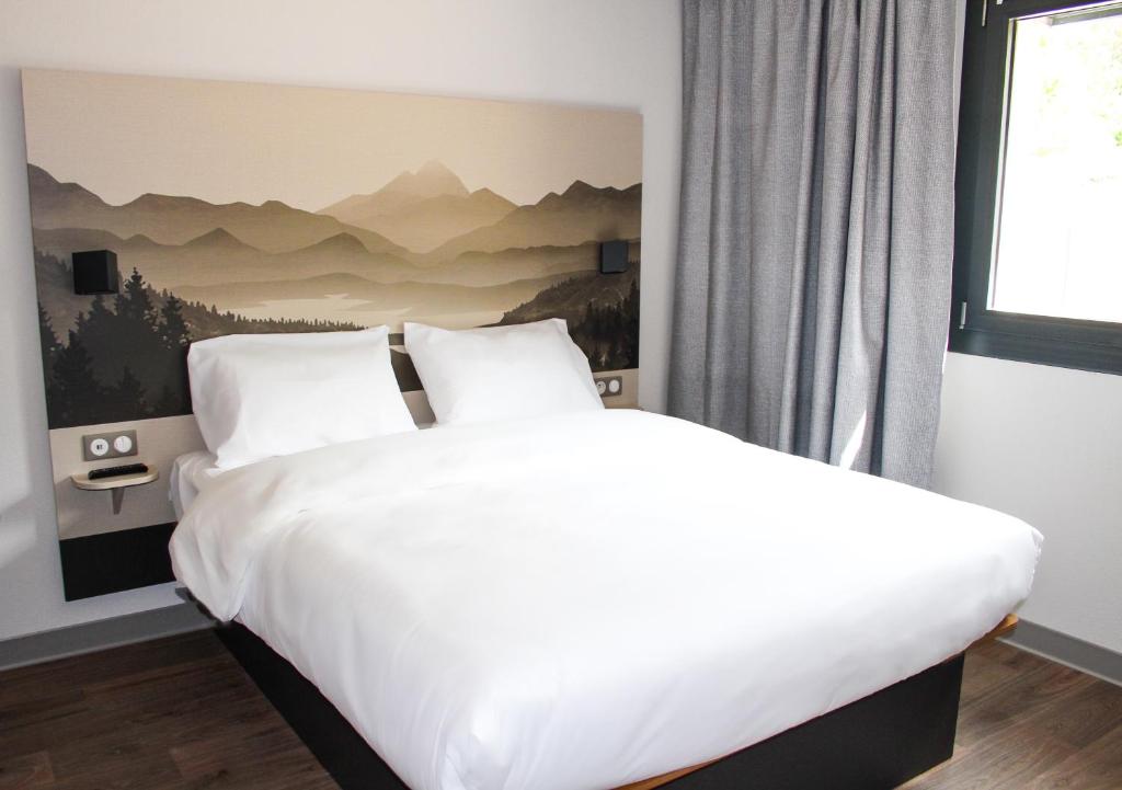Posteľ alebo postele v izbe v ubytovaní B&B HOTEL Aix-les-Bains