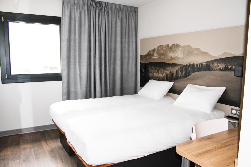 Posteľ alebo postele v izbe v ubytovaní B&B HOTEL Aix-les-Bains
