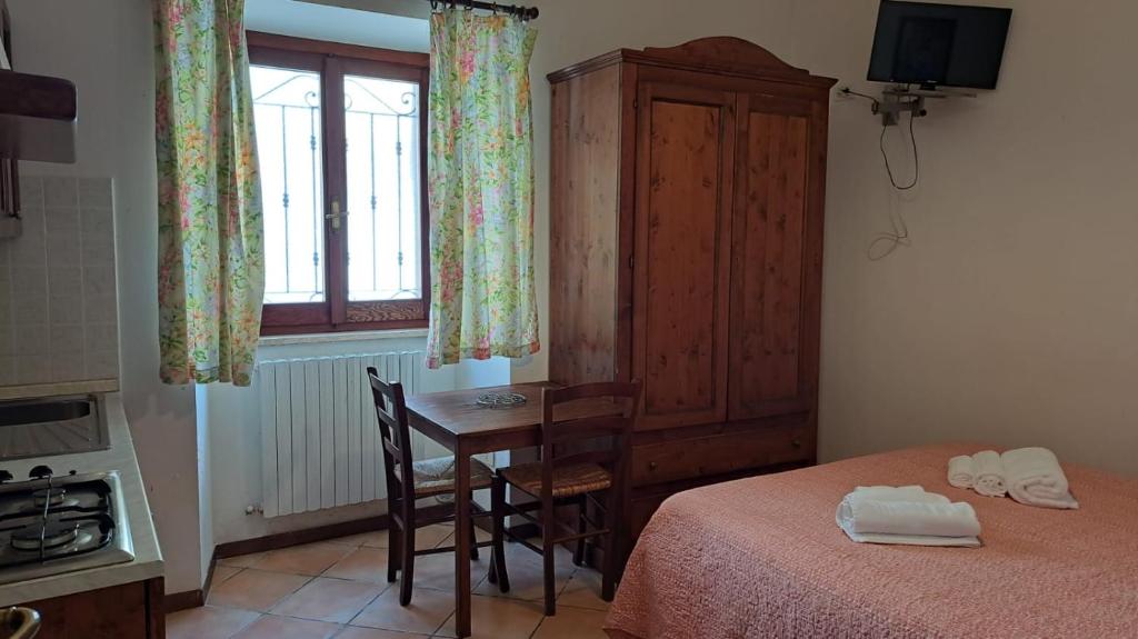 Postel nebo postele na pokoji v ubytování Antico Borghetto - Casa Vacanze