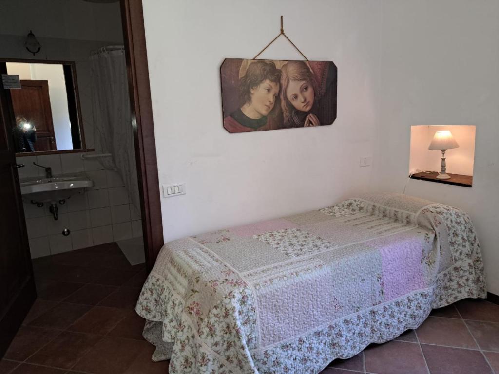 Postel nebo postele na pokoji v ubytování Antico Borghetto - Casa Vacanze