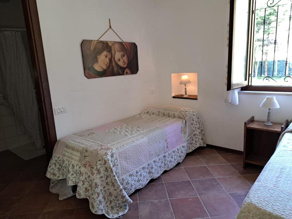 Postel nebo postele na pokoji v ubytování Antico Borghetto - Casa Vacanze
