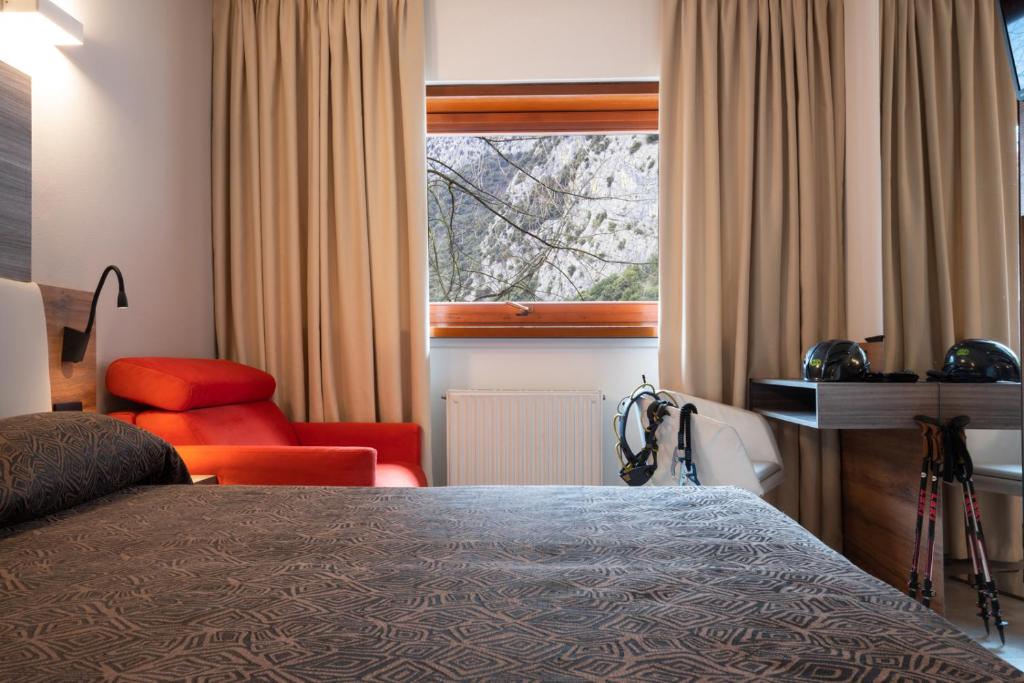 Postel nebo postele na pokoji v ubytování Hotel Ciclamino