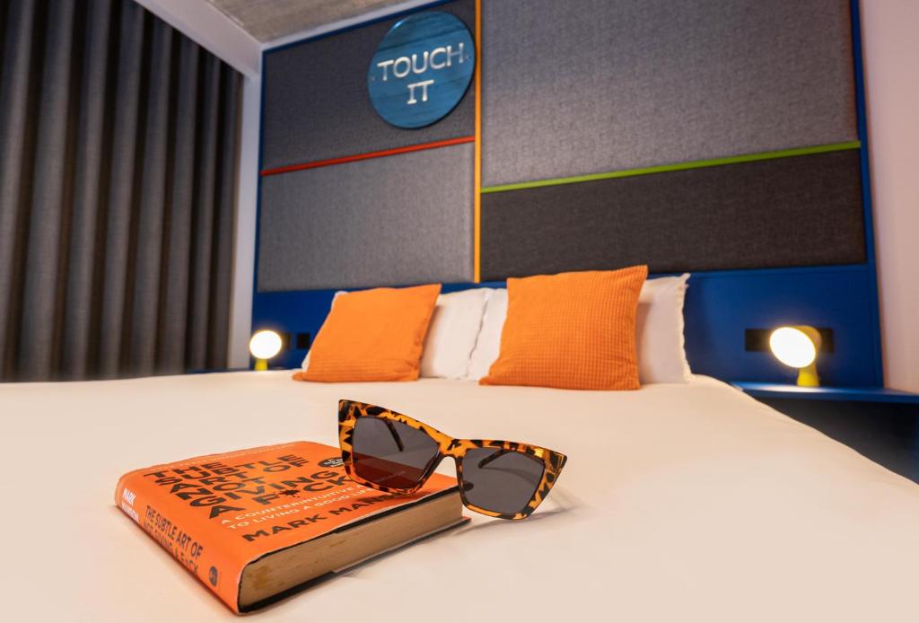Postel nebo postele na pokoji v ubytování IKYK Hotel- IK Collection