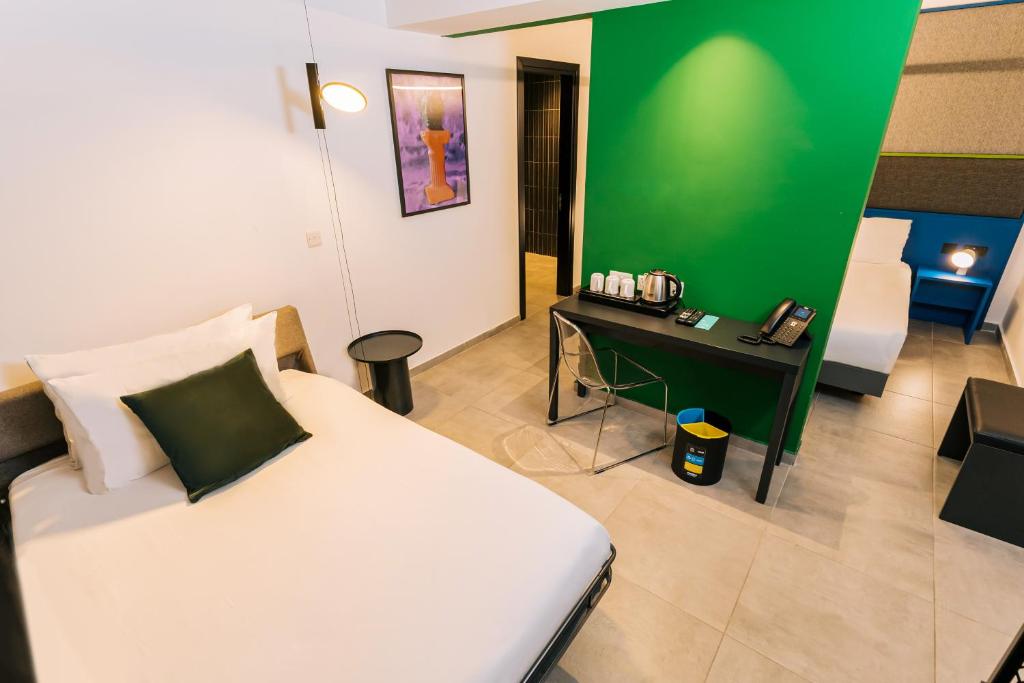 Postel nebo postele na pokoji v ubytování IKYK Hotel- IK Collection