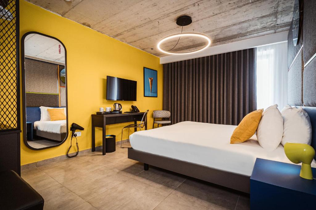 Postel nebo postele na pokoji v ubytování IKYK Hotel- IK Collection