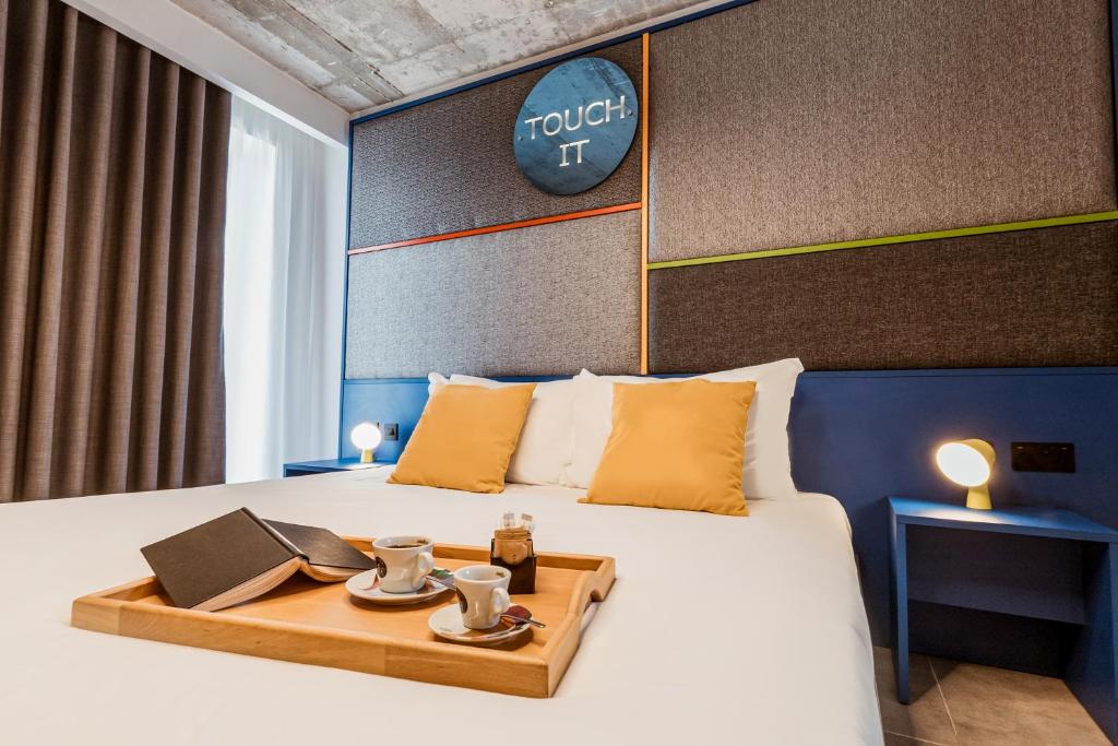 Postel nebo postele na pokoji v ubytování IKYK Hotel- IK Collection