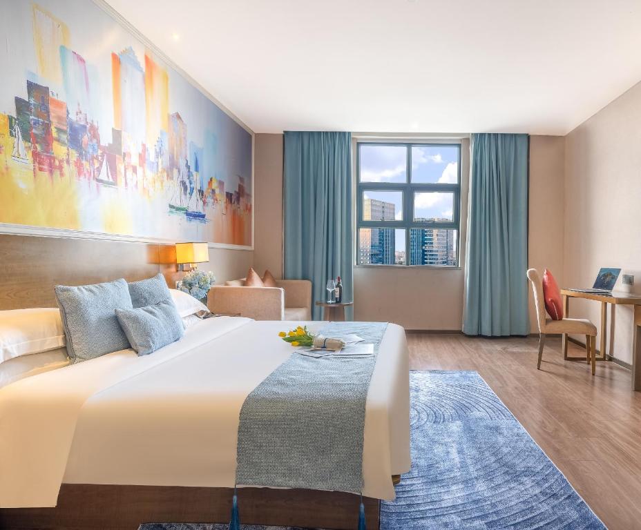 Postel nebo postele na pokoji v ubytování Zhongshan Bafei Hotel