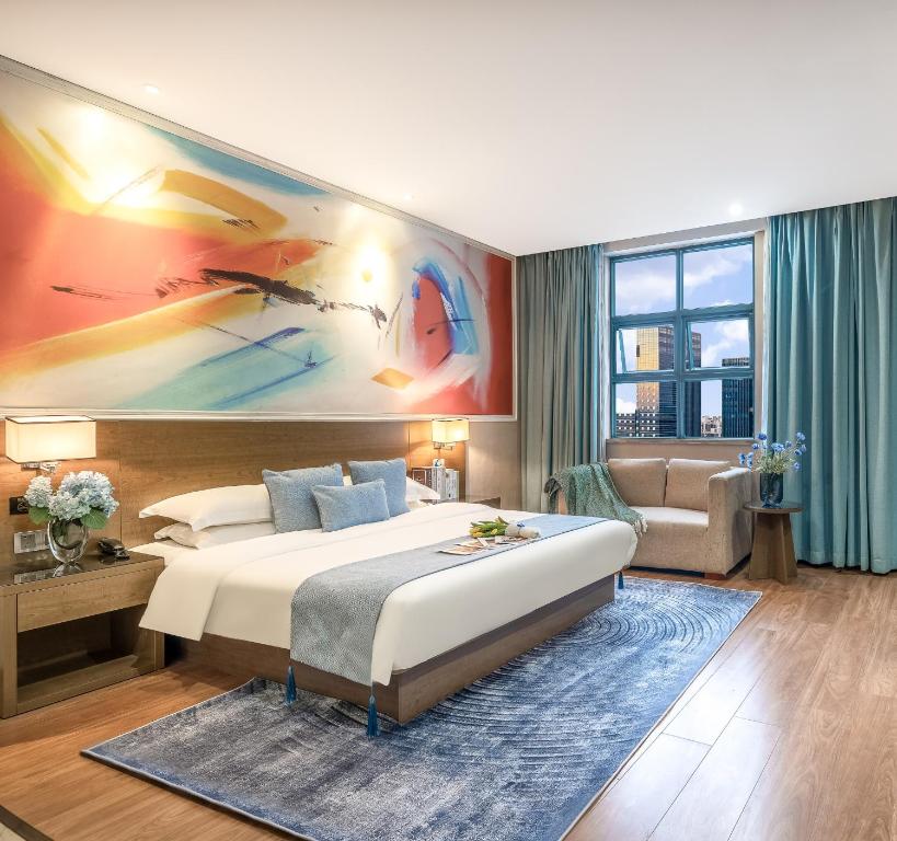Postel nebo postele na pokoji v ubytování Zhongshan Bafei Hotel