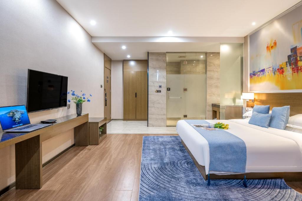 TV a/nebo společenská místnost v ubytování Zhongshan Bafei Hotel