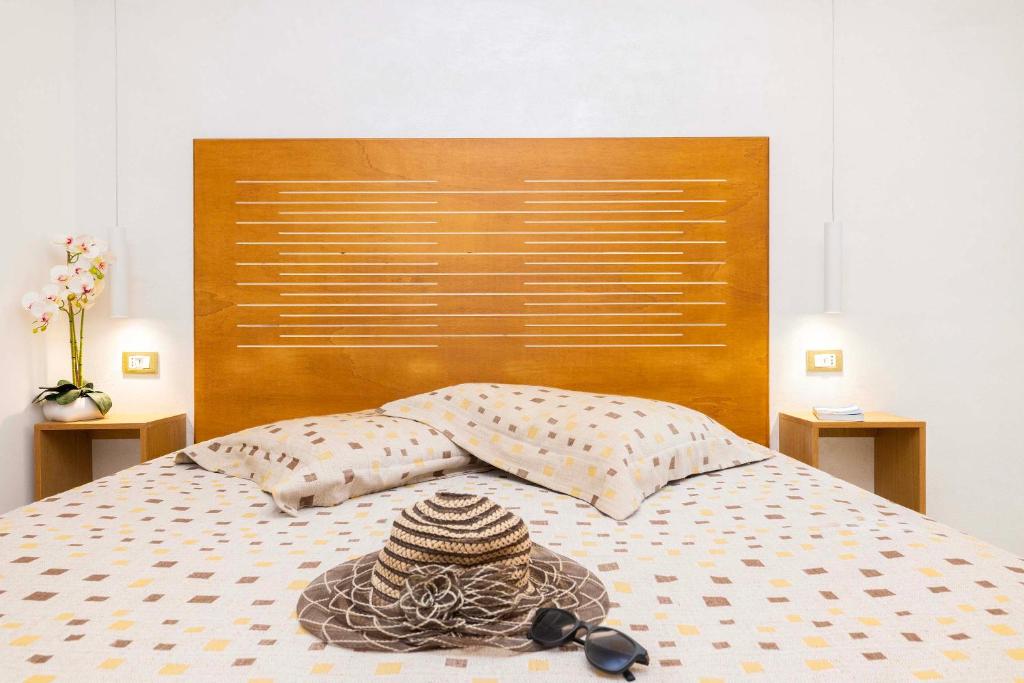 A bed or beds in a room at A Casa di Anna by BarbarHouse