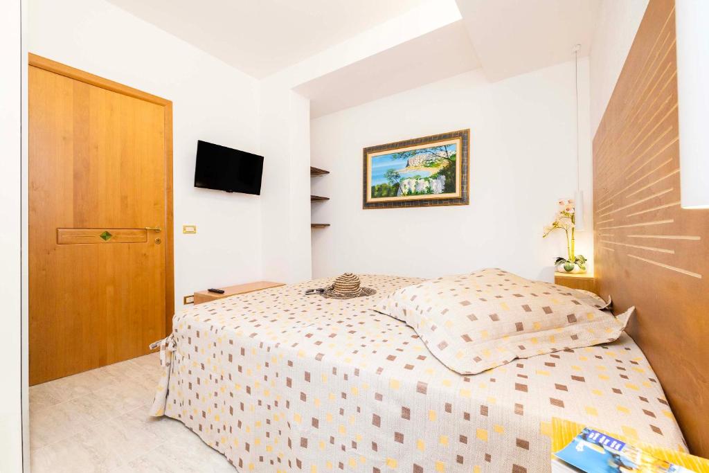 A bed or beds in a room at A Casa di Anna by BarbarHouse