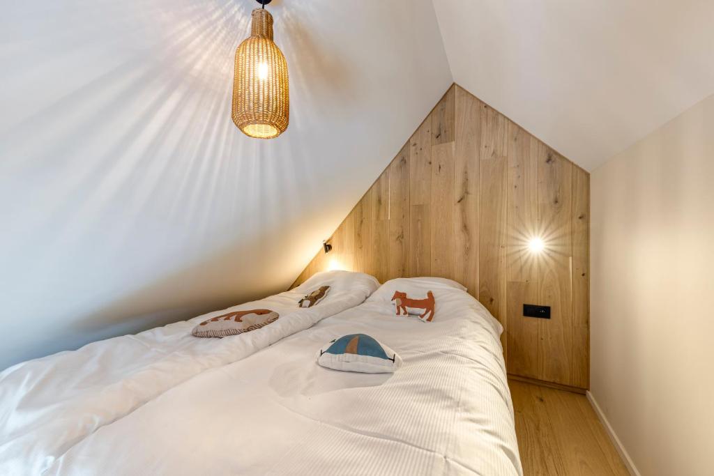 Postel nebo postele na pokoji v ubytování Wood (Forestia)