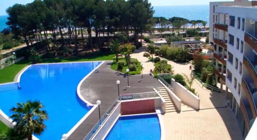 an aerial view of the pool at a resort at Samitier in Cambrils