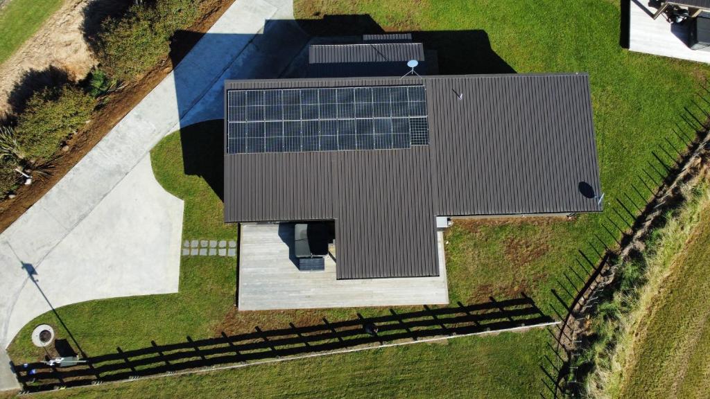 an overhead view of a building with solar panels on it at Ohakune Solar on Snowmass in Ohakune
