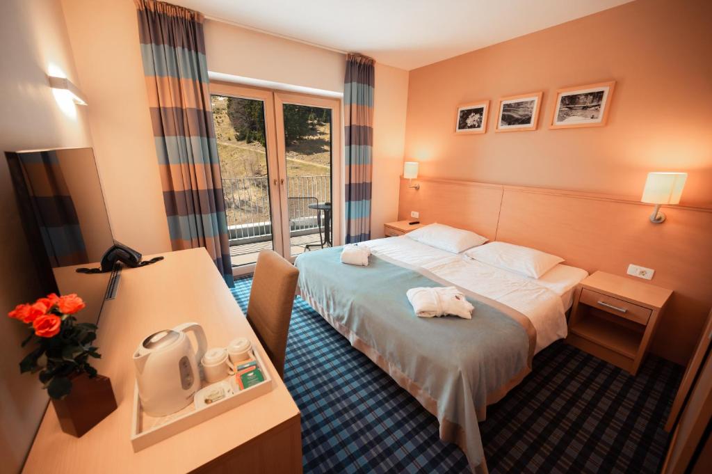 Postelja oz. postelje v sobi nastanitve Wellness Hotel Montis