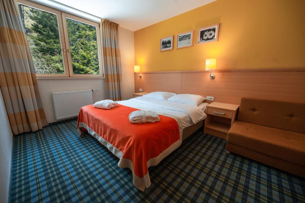 Postelja oz. postelje v sobi nastanitve Wellness Hotel Montis