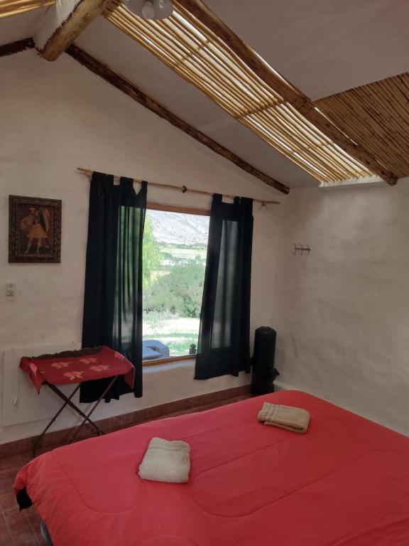 Postel nebo postele na pokoji v ubytování Dormir con llamas