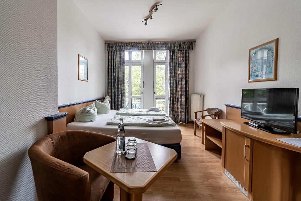TV a/nebo společenská místnost v ubytování Appartement-Hotel-Anlage Tannenpark