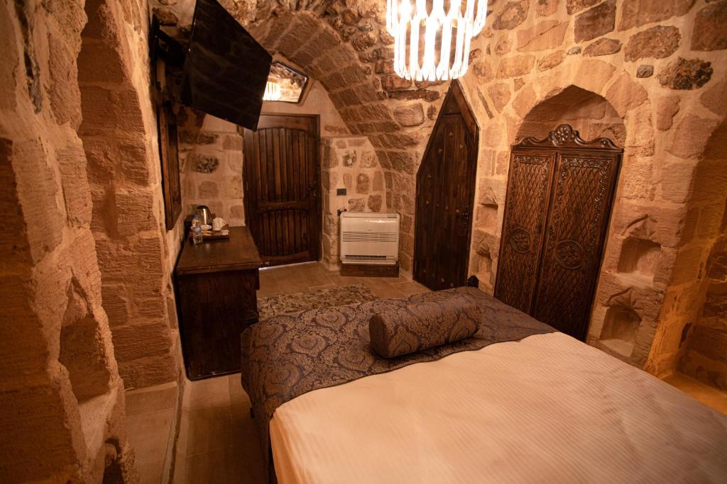 Postel nebo postele na pokoji v ubytování Ankahan Konağı