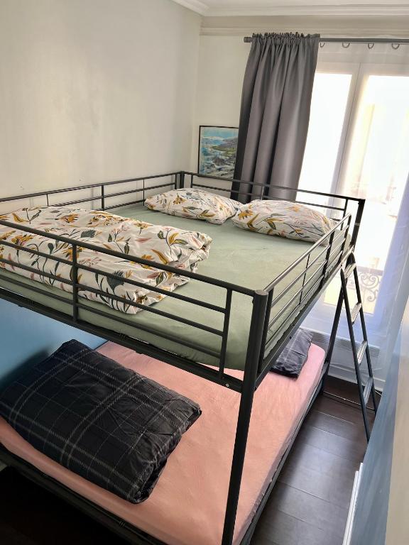 Posteľ alebo postele v izbe v ubytovaní Superbe 2 Chambres Proche Montmartre