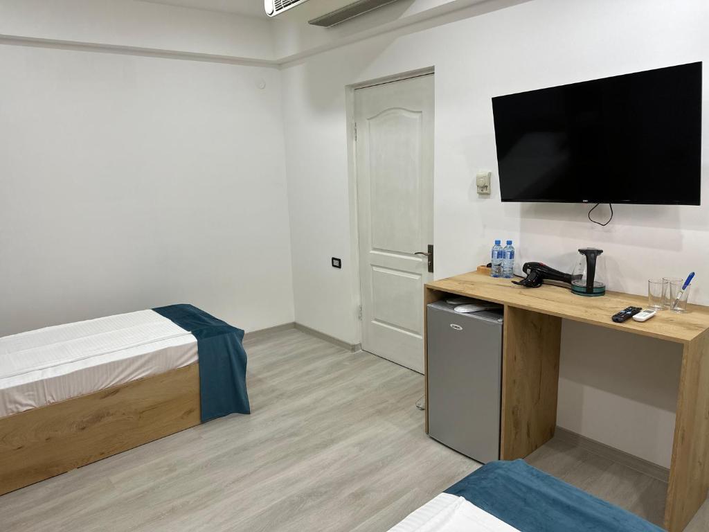 Postel nebo postele na pokoji v ubytování Friendly Hotel
