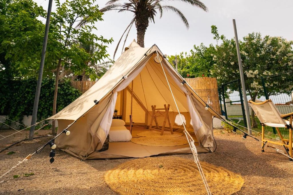 a small tent with a table in it at Kampaoh Benajarafe in Los Puertas