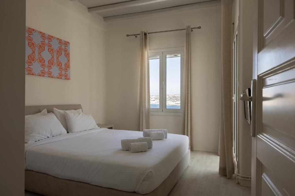 Voodi või voodid majutusasutuse Amaris Mykonian Residence toas