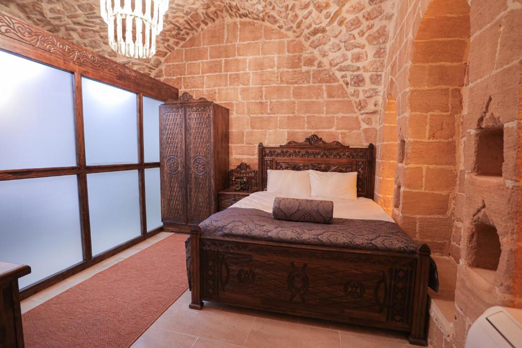Postel nebo postele na pokoji v ubytování Ankahan Konağı
