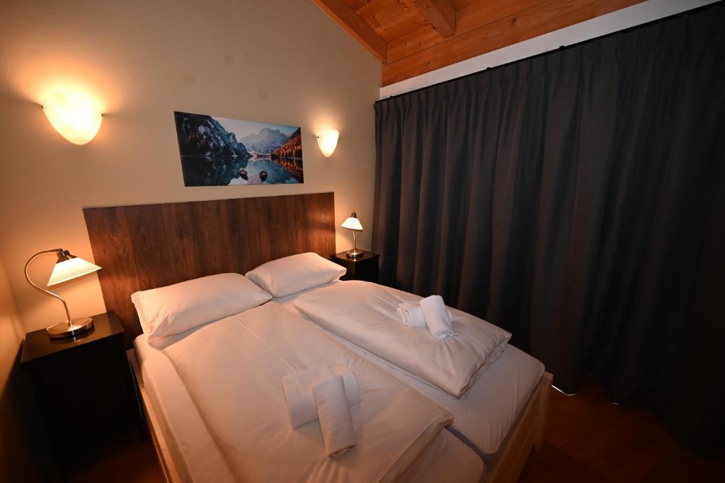 Una cama o camas en una habitación de Apartment KatrinB15- by Four Seasons Apartment