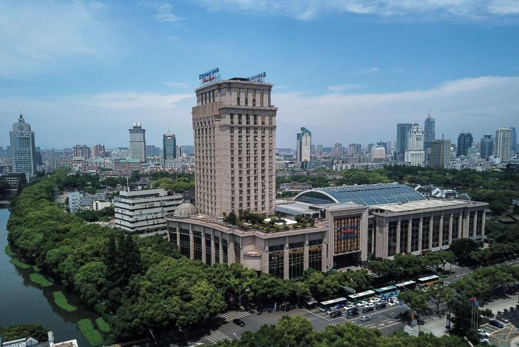 a view of a building with a city in the background at Wyndham Grand Plaza Royale Ningbo in Ningbo