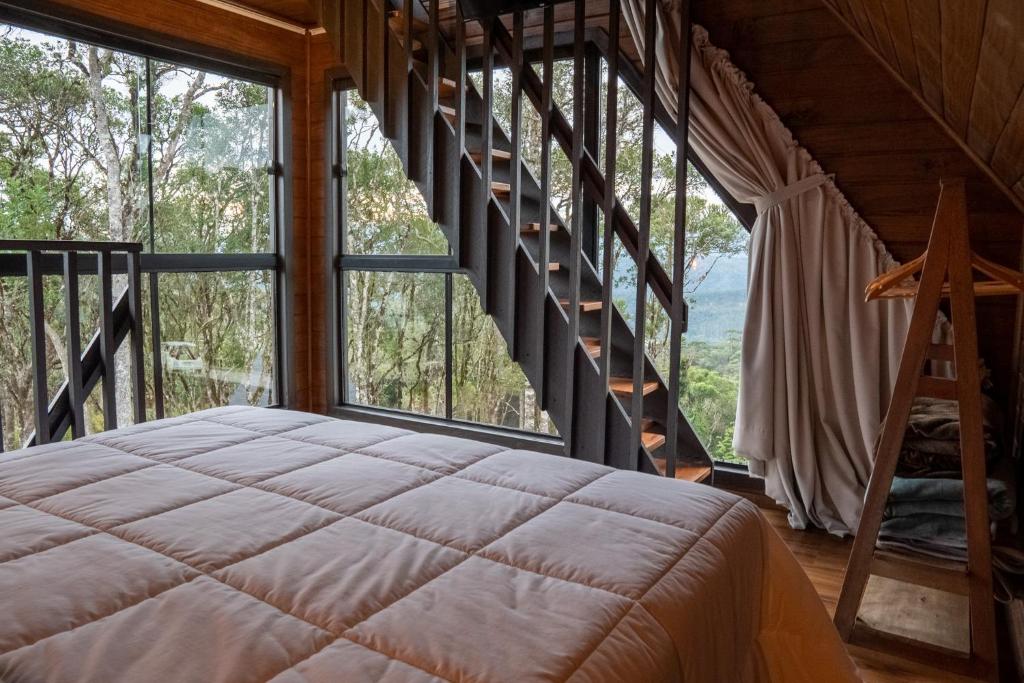 Postel nebo postele na pokoji v ubytování Cabanas Cold Mountain