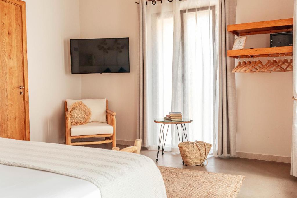 Postel nebo postele na pokoji v ubytování Ōrigins Hotel Boutique - Adults Only