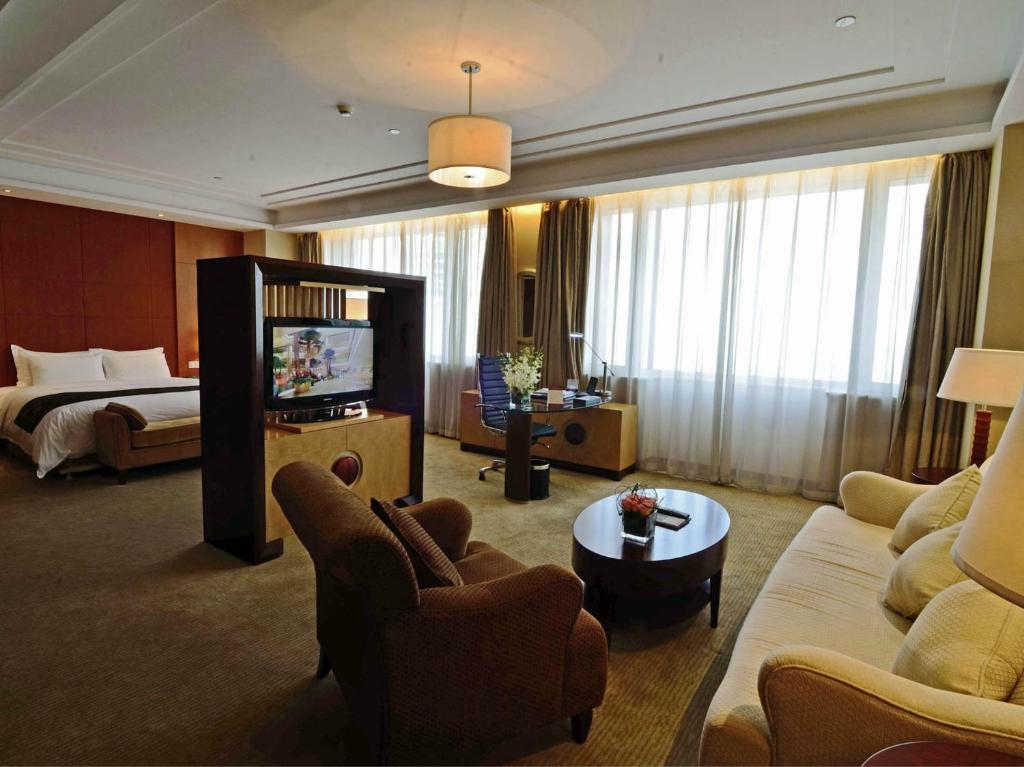 TV a/nebo společenská místnost v ubytování Tianjin Saixiang Hotel