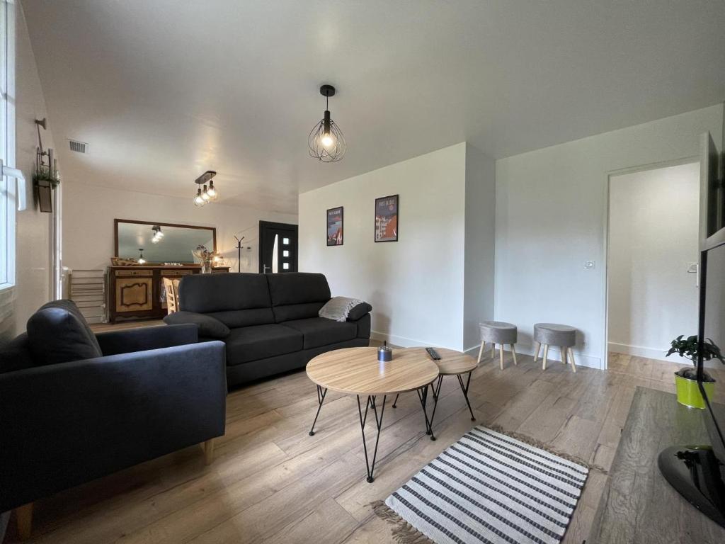 a living room with a couch and a table at Gure doya in Ibarrolle