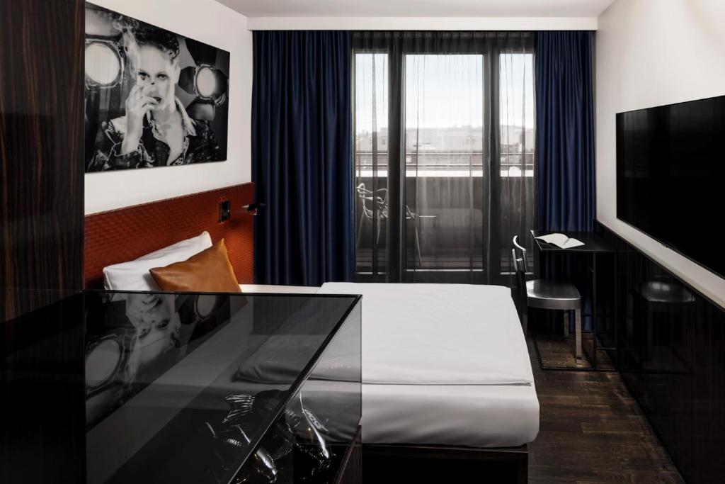 Postel nebo postele na pokoji v ubytování Hotel MANI by AMANO