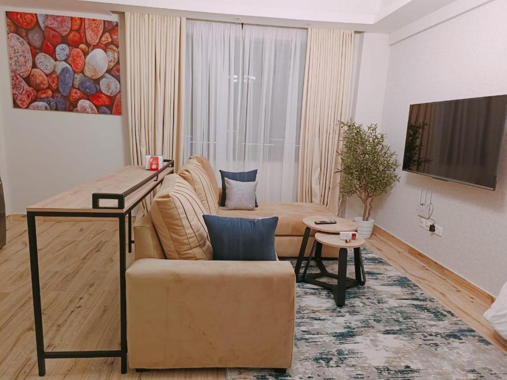 TV a/nebo společenská místnost v ubytování Nzuri Elite-1 bedroom