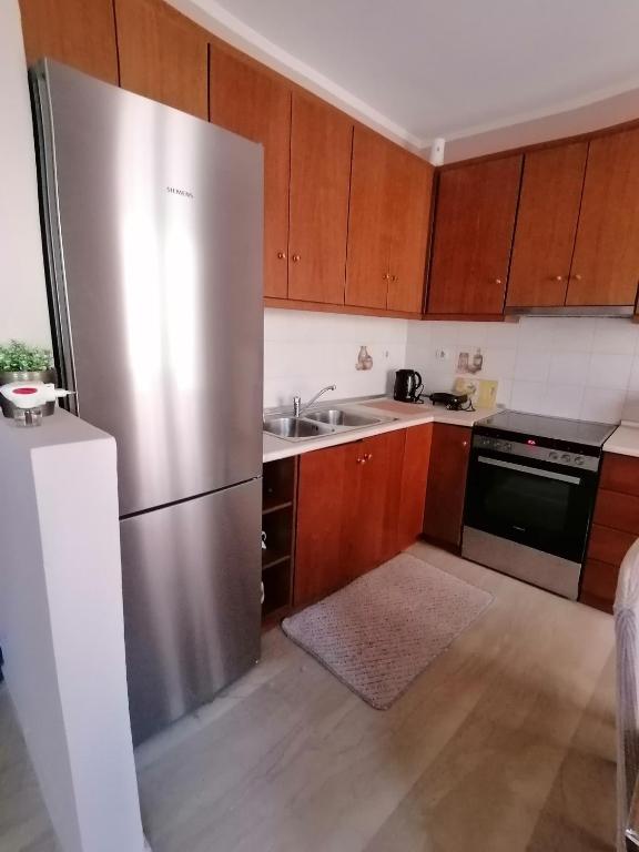 Kuchyň nebo kuchyňský kout v ubytování flower garden apartment