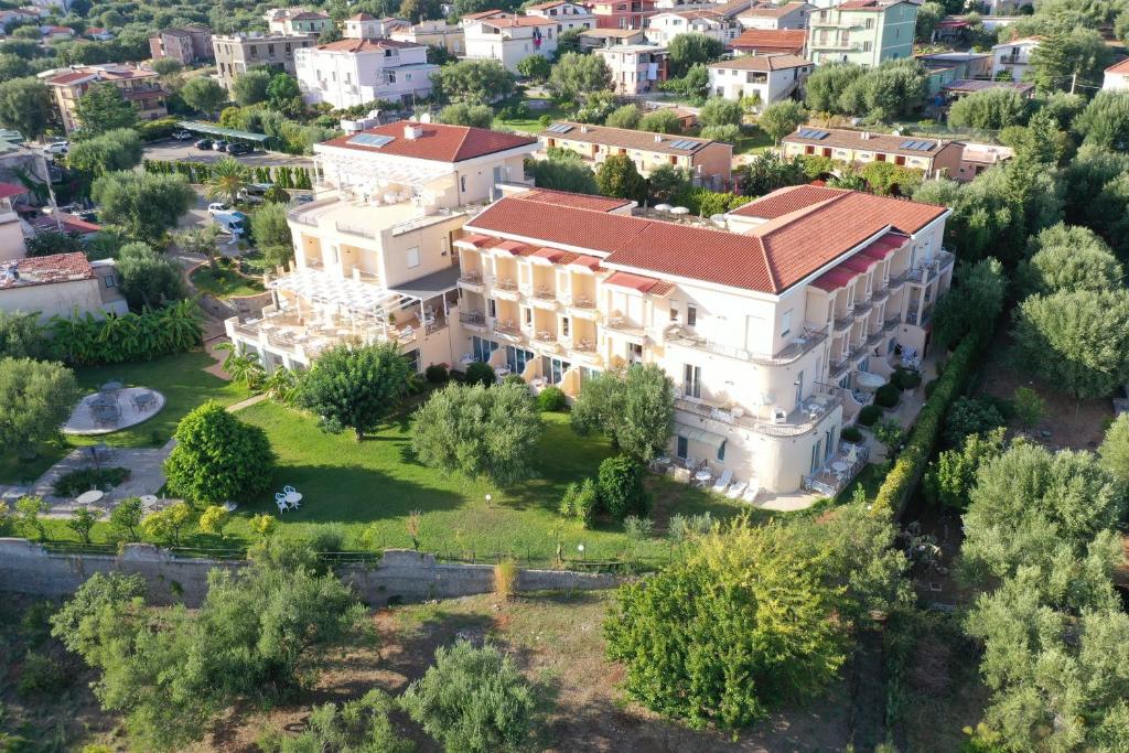 an aerial view of a large white building with a red roof at Hotel America in Marina di Camerota