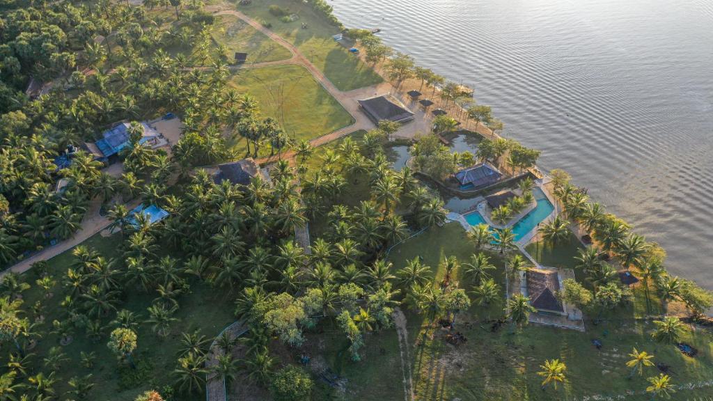 an aerial view of a resort in the middle of the water at The Cove Pasikuda - Eco Resort in Pasikuda