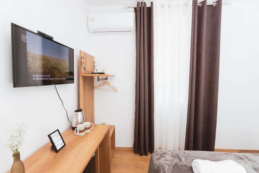 TV a/nebo společenská místnost v ubytování Hotel Tier Center