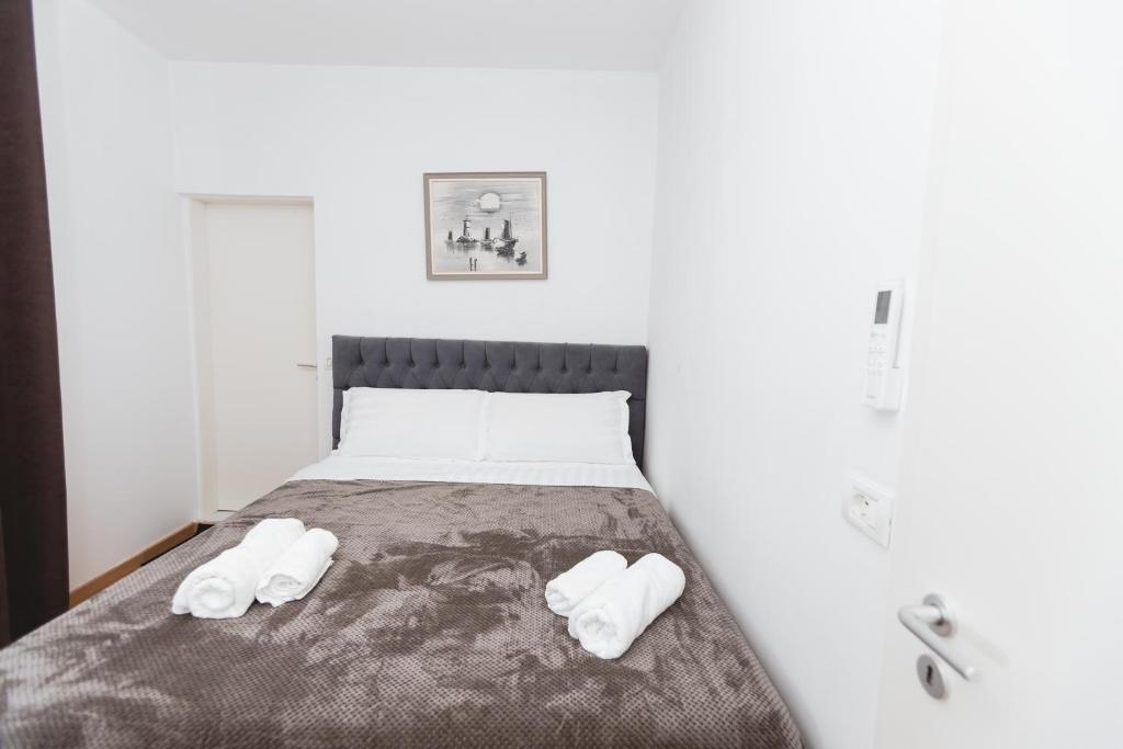 Postel nebo postele na pokoji v ubytování Hotel Tier Center
