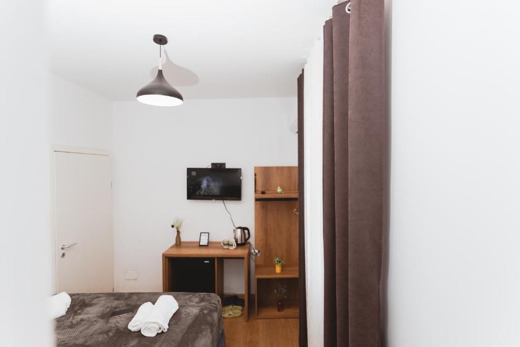 TV a/nebo společenská místnost v ubytování Hotel Tier Center
