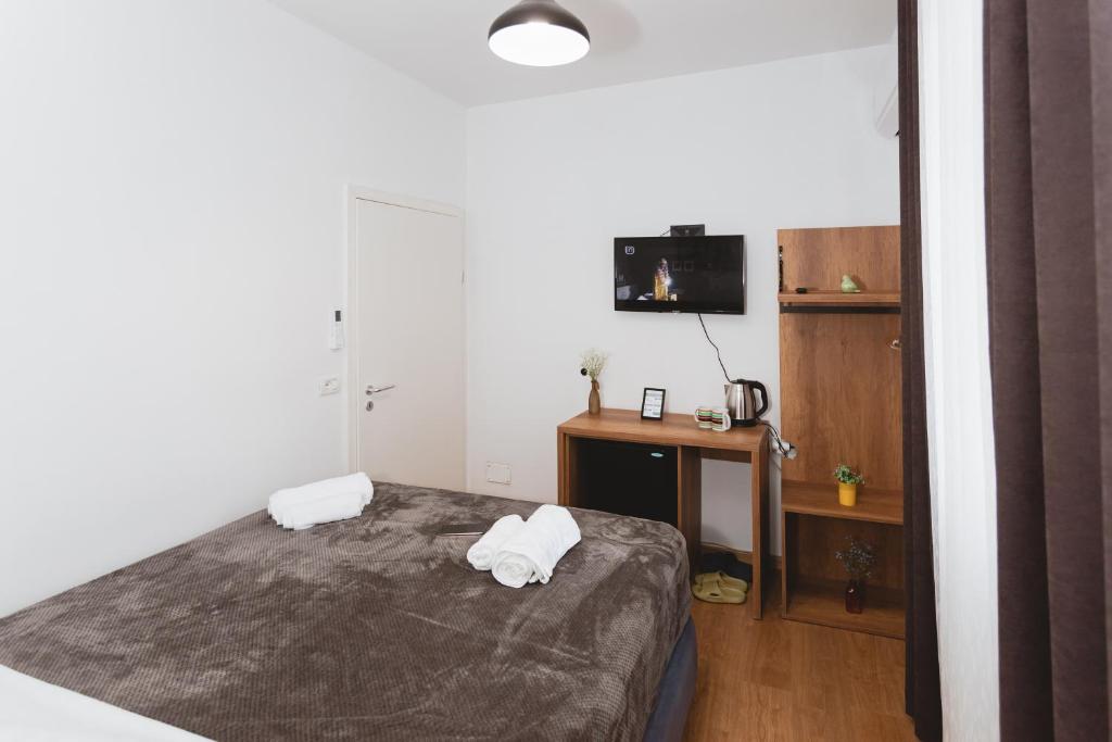 Postel nebo postele na pokoji v ubytování Hotel Tier Center