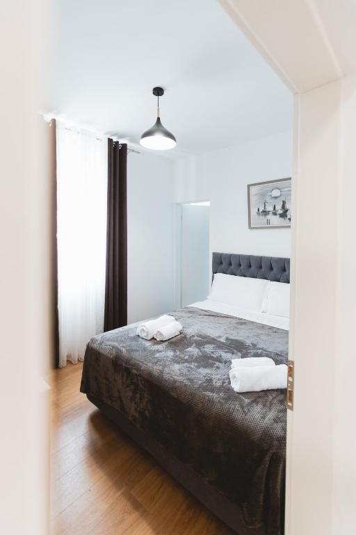 Postel nebo postele na pokoji v ubytování Hotel Tier Center