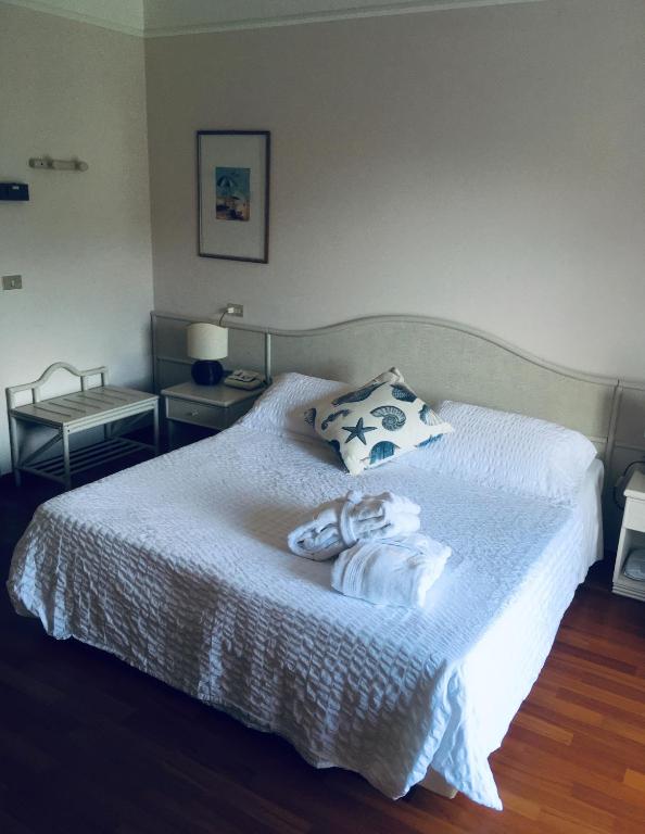 Posteľ alebo postele v izbe v ubytovaní Hotel Abbazia