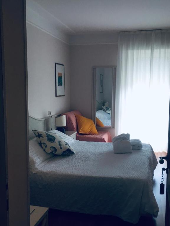 Posteľ alebo postele v izbe v ubytovaní Hotel Abbazia
