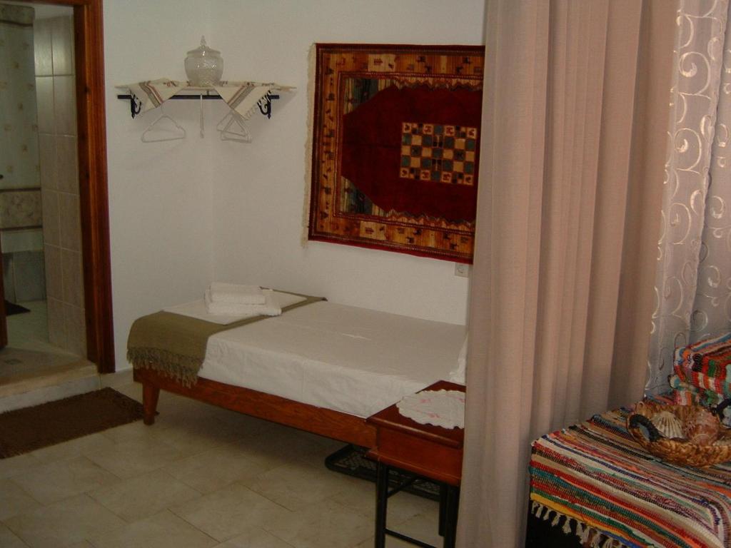 Postel nebo postele na pokoji v ubytování Yiayia's Home