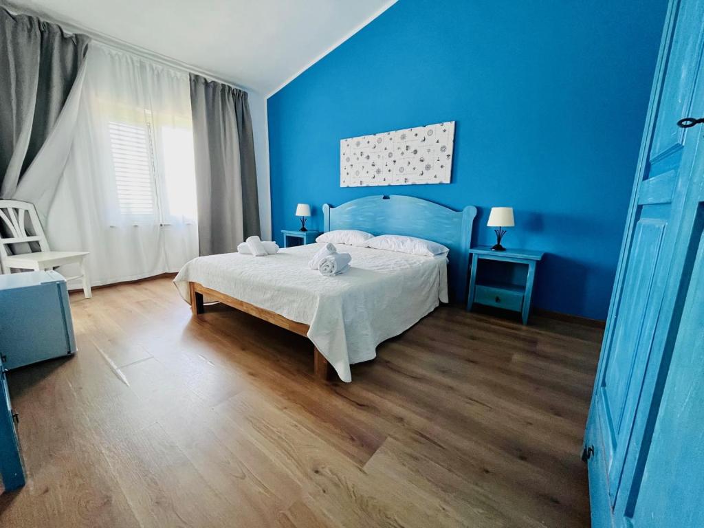 Postel nebo postele na pokoji v ubytování Hotel Frassetto