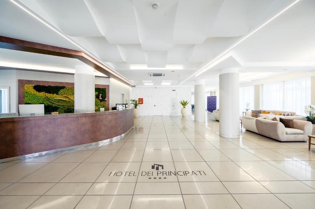 a lobby of a hospital with couches and a reception desk at Hotel Dei Principati in Baronissi