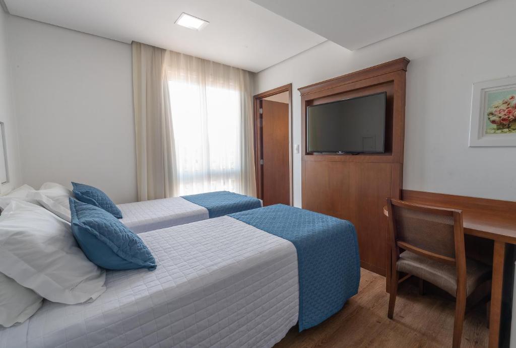 Postel nebo postele na pokoji v ubytování Hotel Monte Felice Centro